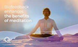Person experiencing the enhanced benefits of meditation through biofeedback