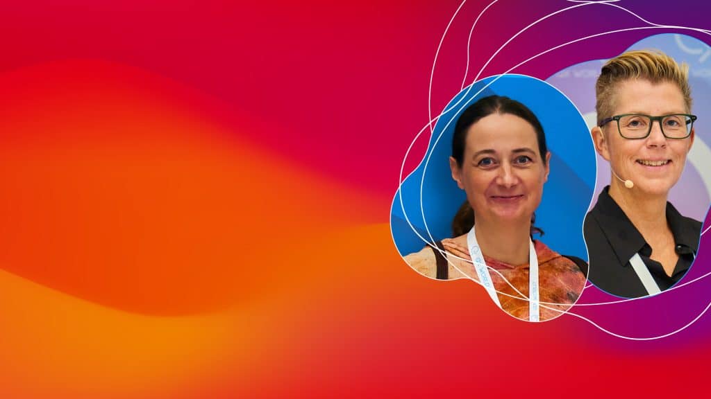 Two women executives in colorful abstract graphic background