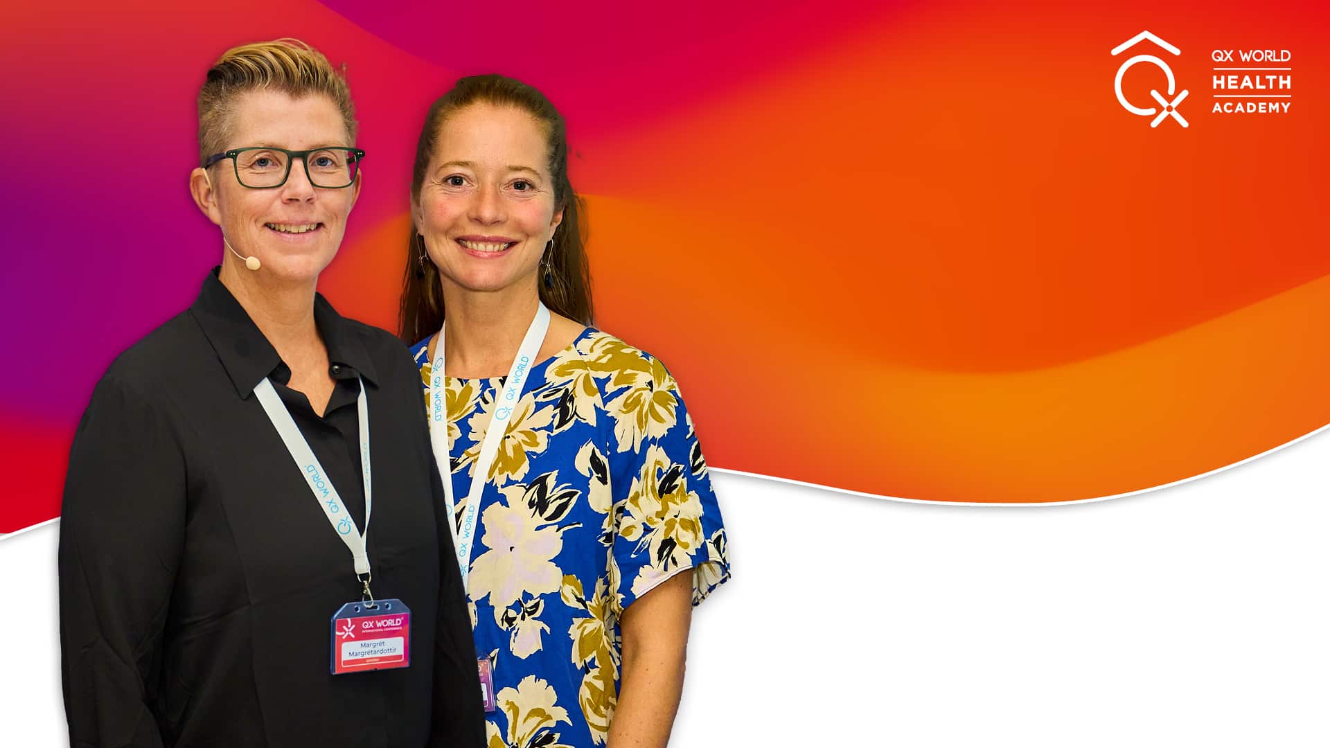 Two women wearing lanyards at health conference